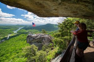 View of Chimney Rock towering above the valley floor in Chimney Rock State Park, North Carolina.